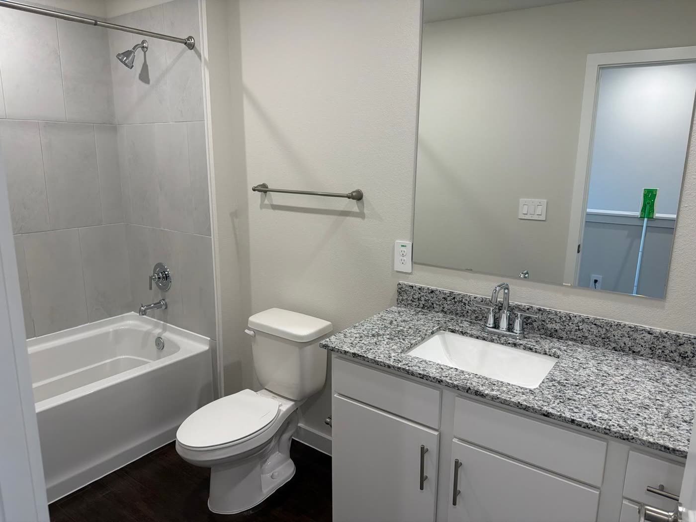 Spotless apartment bathroom, tub and vanity