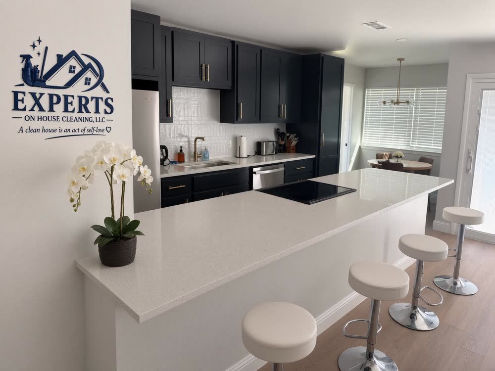 A serviced kitchen with the Experts on House Cleaning, LLC logo displayed on the wall