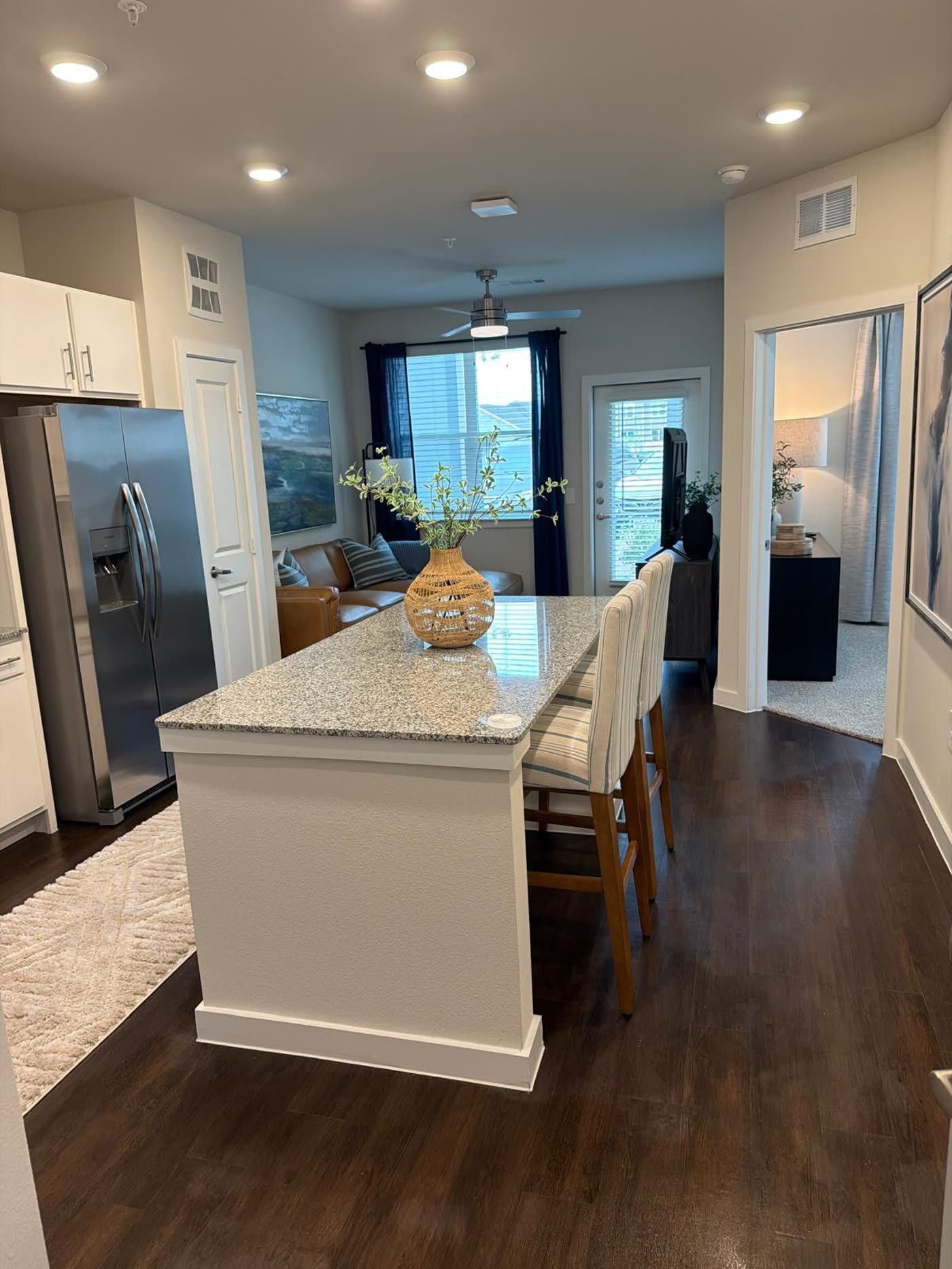 Clean, move-in-ready apartment kitchen and living area